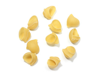 A lot of italian's raw pasta(macaroni) conchiglie on a white background