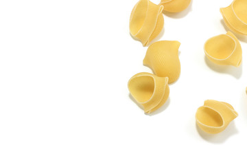 A lot of italian's raw pasta(macaroni) conchiglie on a white background