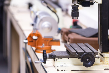 Drilling machine. Work Desk in the workshop.