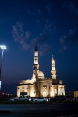 Fototapeta na wymiar Mosque in Sharjah against the night sky, Emirates.