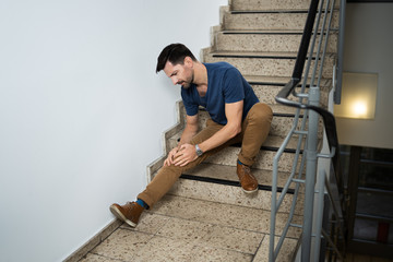 Man Sitting On Staircase