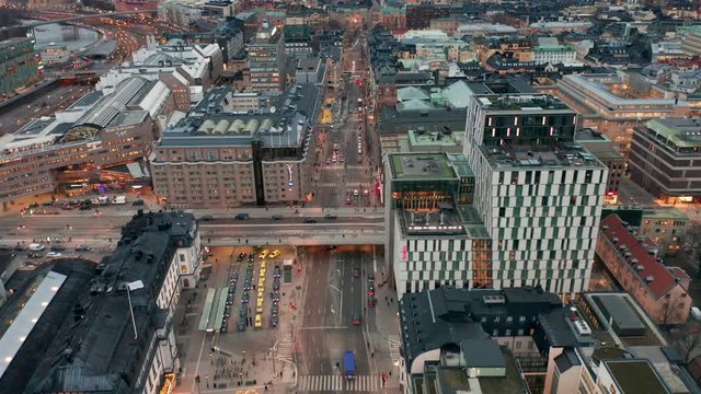 Vasagatan in Stockholm City. Cars, traffic & people movement. Aerial view.