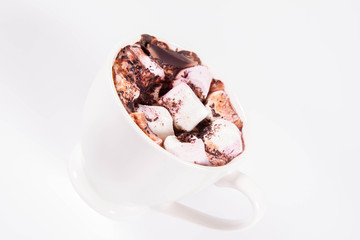 Cup of hot chocolate with marshmallows on a white background	
