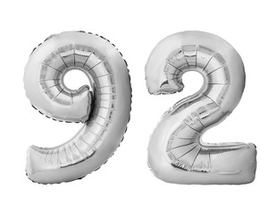 Number 92 ninety two made of silver inflatable balloons isolated on white background. Silver chrome helium balloons forming 92 ninety two number