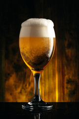 Glass of beer on wooden