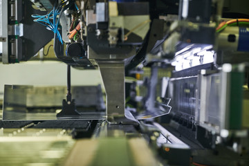 Panel bending machine at work. process of metal sheet forming