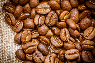 Premium quality light roasted coffee beans rotating. Close up of brown roasted coffee beans