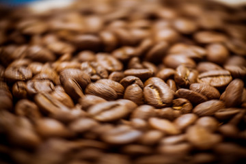 Beans of roasted black coffee. Background. Brown coffee beans, of coffee beans for background and...