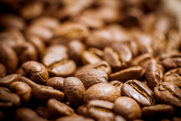 Beans of roasted black coffee. Background. Brown coffee beans, of coffee beans for background and texture.