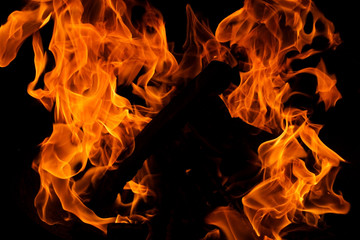 close-up of fire in a fireplace with black background