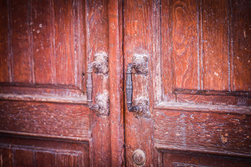 ancient doors close up within the historical streets of Rome