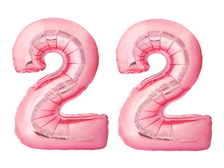 Number 22 twenty two made of rose gold inflatable balloons isolated on white background. Pink...