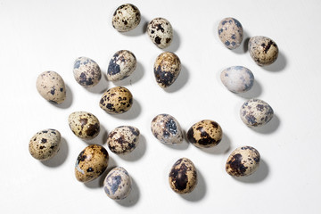 Fototapeta premium Quail eggs on white background. Eggs quail spotted small on white background.