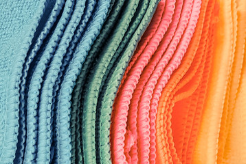 Pile of Multicolored Cloths used for background wallpaper textures Vinatge style