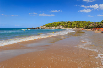Apulia beach: Bay of Sfinale, between Peschici and Vieste, with an ancient Torre Saracena, typical...