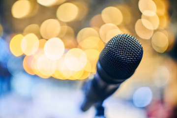 Close-up of microphone on  background of blurry lights