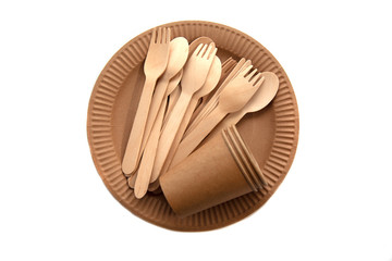 Crockery made from eco kraft paper, paper cups, dishes, bag, fast food containers isolated on white background. Recycling concept. Zero waste. Close-up..