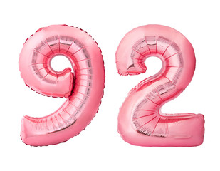 Number 92 ninety two made of rose gold inflatable balloons isolated on white background. Pink helium balloons forming 92 ninety two number