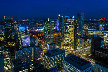 Beautiful aerial shot of the city of Warsaw. Poland. Drone flies over the city by the night lights...