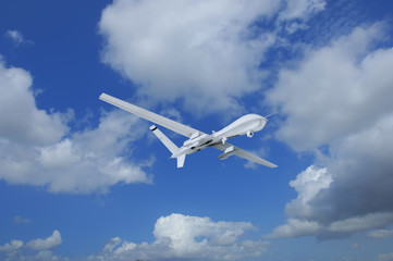 Fototapeta na wymiar military RC military drone flies flies against backdrop of beautiful clouds on blue sky background. Elements of this image furnished by NASA