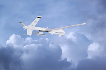 military RC military drone flies against the backdrop of blue peaceful sky with white clouds