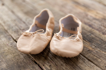 ballet shoes  laying on rough vintage wood, with natural light, Ballet shoes for Kids © ohne Titel