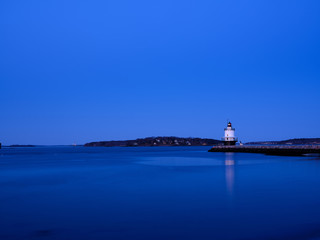 Fototapeta na wymiar Blue hour at the Spring Ledge Lighthouse on Casco Bay in South Portland Maine