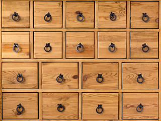 Wooden cabinet with drawers. Closeup of vintage wooden furniture with drawers