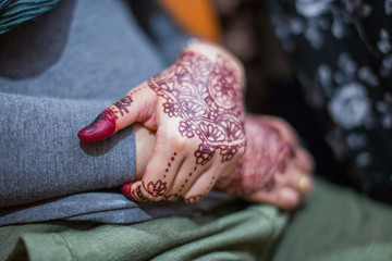 Very beautiful and unique henna paintings on both hands of the bride.