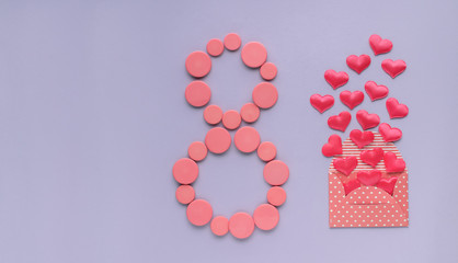 8 March, International Women's Day. Figure eight of pink buttons, envelope with hearts.