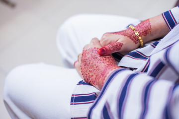 Very beautiful and unique henna paintings on both hands of the bride.