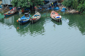 Obraz premium The fishing boat parked at the river