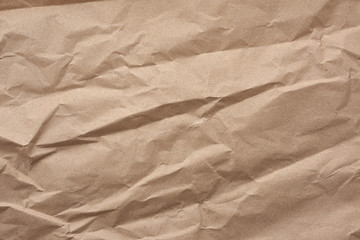 fragment of crumpled blank sheet of brown wrapping kraft paper