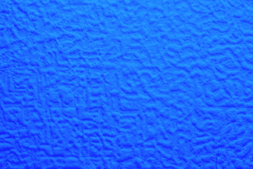 blue foam texture with uneven wavy surface, full frame