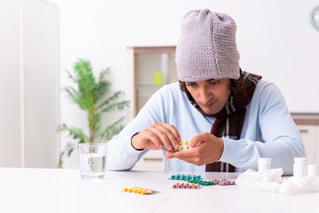 Young man suffering from flu at home