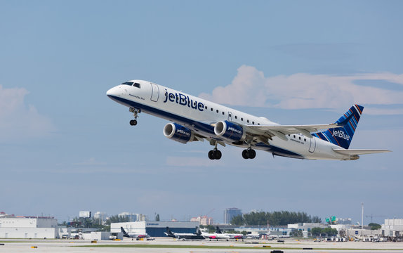 FORT LAUDERDALE, USA - June 19, 2016: A Jetblue Embraer 190 aircraft departing the Fort Lauderdale/Hollywood International Airport.