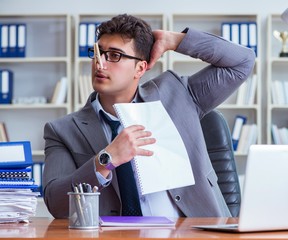 Businessman sweating excessively smelling bad in office at workp