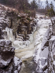 Fototapeta na wymiar Frozen waterfalls in Adirondack Mountains