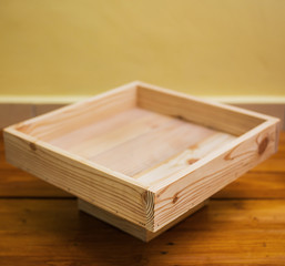 Small wooden tray made of used pallet wood.