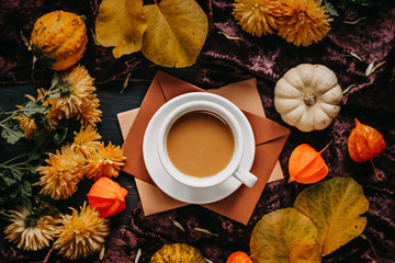 Cup of coffee with milk. Autumn concept. Still life picture