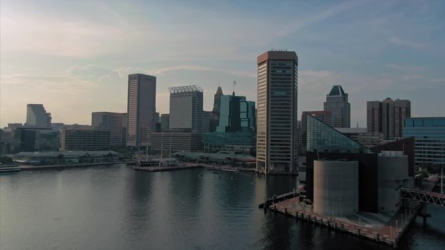 Aerial flying over baltimore harbor City Skyline. Baltimore, Maryland, USA