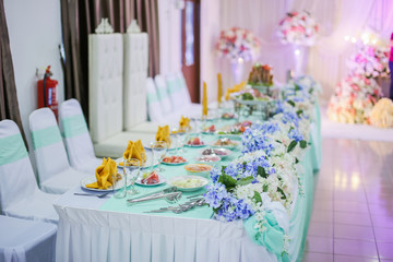 Dining table decorated for weddings held in Malaysia. The decoration is decorated by caterer.