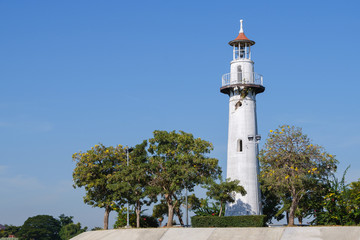 Coast white lighthouse blue sky background