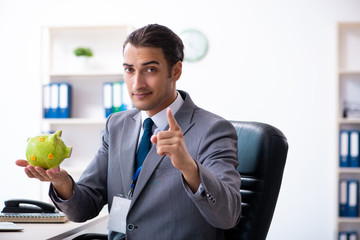 Young male accountant working in the office