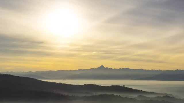 Mountains at Sunset with clouds and fog