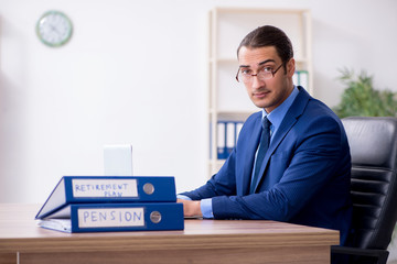 Young male accountant working in the office