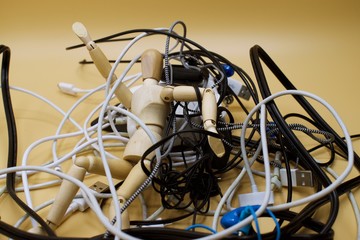 Drawing mannequin trapped within a pile of wires