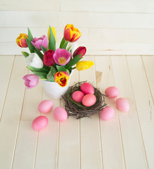 Easter holiday tulips and pink eggs.