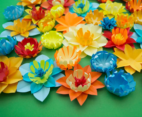 Flowers made of paper. Green background.