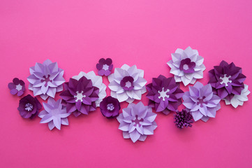 Fototapeta na wymiar Flowers made of paper. Pink background.